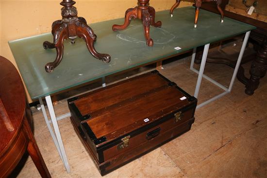 Glass top table on metal stands